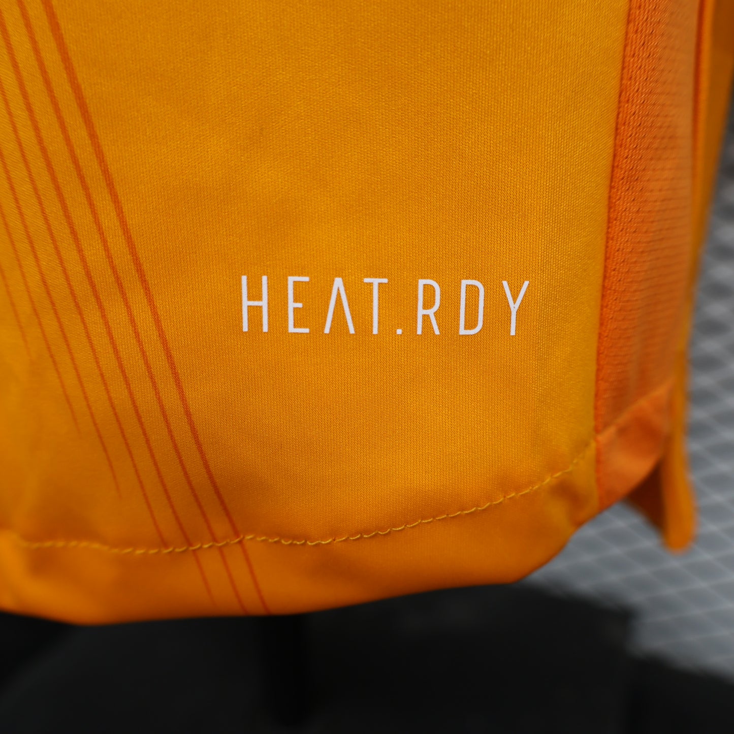CAMISETA REAL MADRID NARANJA 24/25 HOMBRE (VERSIÓN JUGADOR)